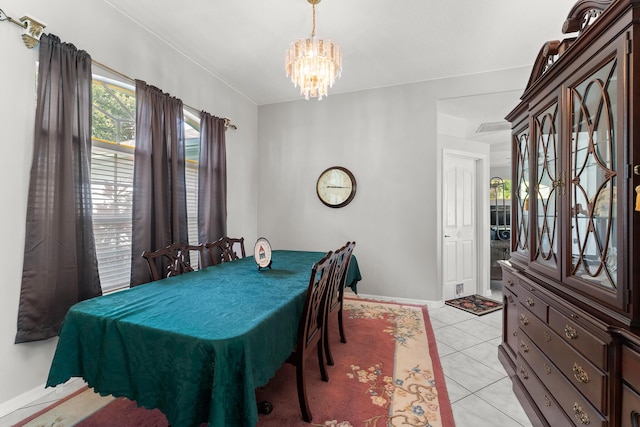 165 SE Osprey Rdg, Port Saint Lucie, FL 34984 - dining room featuring a chandelier, baseboards, and light tile patterned floors