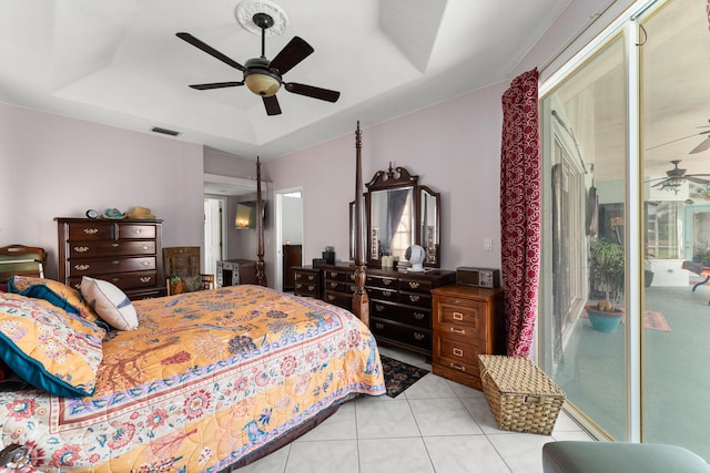 165 SE Osprey Rdg, Port Saint Lucie, FL 34984 - bedroom with a raised ceiling, light tile patterned flooring, and ceiling fan