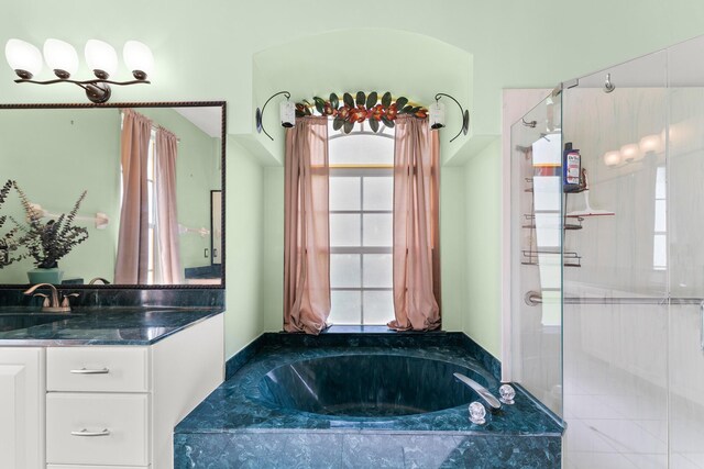165 SE Osprey Rdg, Port Saint Lucie, FL 34984 - bathroom featuring a stall shower, a garden tub, and vanity