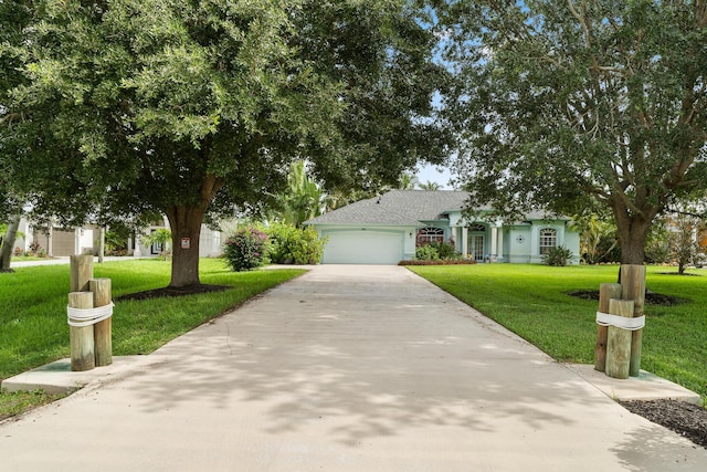165 SE Osprey Rdg, Port Saint Lucie, FL 34984 - view of front of home with driveway, a garage, and a front yard