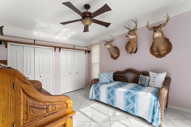 165 SE Osprey Rdg, Port Saint Lucie, FL 34984 - bedroom featuring two closets and a ceiling fan