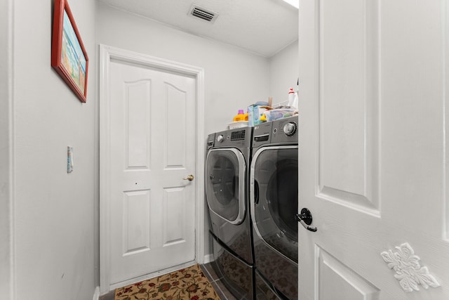 165 SE Osprey Rdg, Port Saint Lucie, FL 34984 - laundry room featuring independent washer and dryer and baseboards