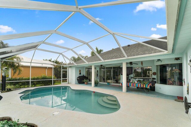 165 SE Osprey Rdg, Port Saint Lucie, FL 34984 - swimming pool with a ceiling fan, a patio area, and glass enclosure