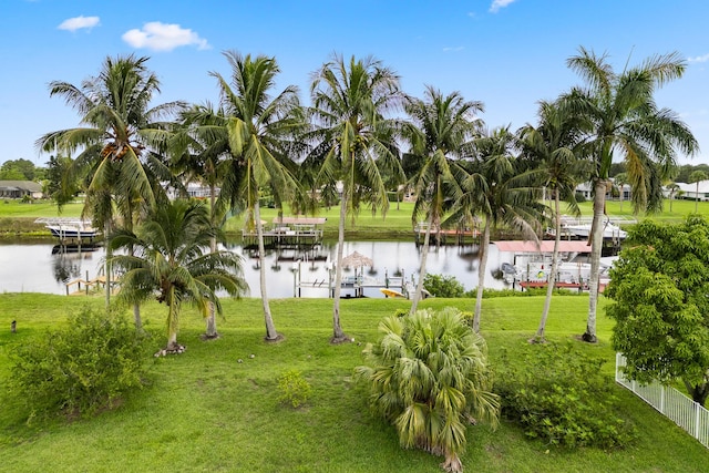165 SE Osprey Rdg, Port Saint Lucie, FL 34984 - view of green lawn featuring a water view, a boat dock, and boat lift