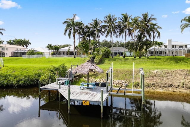 165 SE Osprey Rdg, Port Saint Lucie, FL 34984 - dock area with a water view, a lawn, and a residential view