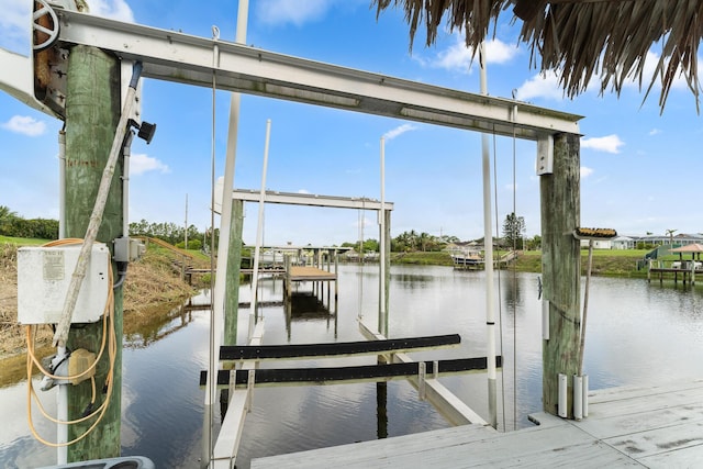 165 SE Osprey Rdg, Port Saint Lucie, FL 34984 - dock with boat lift and a water view