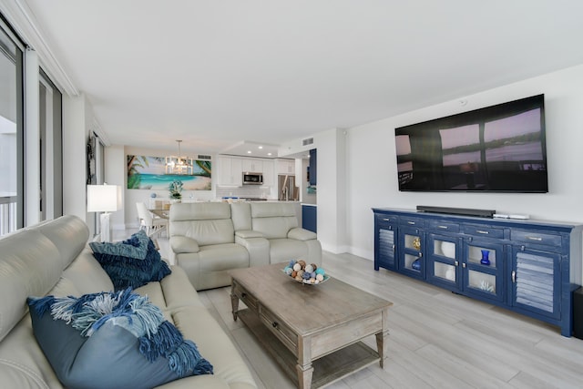 123 Lakeshore Dr Unit 1145, North Palm Beach, FL 33408 - living area featuring light wood finished floors, a chandelier, baseboards, and recessed lighting