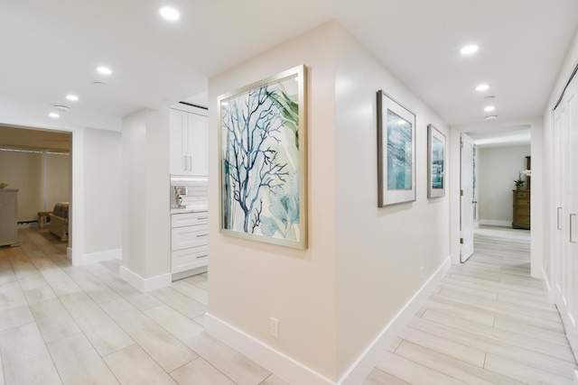 123 Lakeshore Dr Unit 1145, North Palm Beach, FL 33408 - hall featuring recessed lighting, baseboards, and light wood finished floors