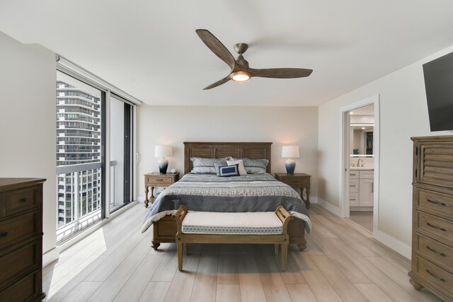 123 Lakeshore Dr Unit 1145, North Palm Beach, FL 33408 - bedroom featuring light wood finished floors, a sink, ensuite bath, access to outside, and a ceiling fan