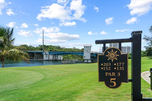 123 Lakeshore Dr Unit 1145, North Palm Beach, FL 33408 - view of community featuring a water view, a lawn, and view of golf course