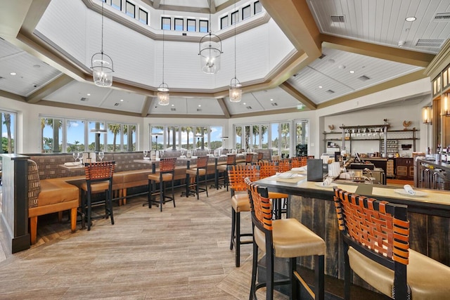 123 Lakeshore Dr Unit 1145, North Palm Beach, FL 33408 - dining space with a high ceiling, a community bar, and recessed lighting