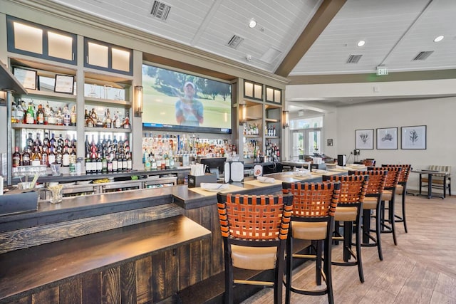 123 Lakeshore Dr Unit 1145, North Palm Beach, FL 33408 - community bar area with light wood-style flooring and vaulted ceiling