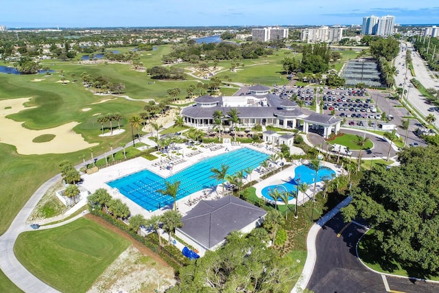 123 Lakeshore Dr Unit 1145, North Palm Beach, FL 33408 - bird's eye view of a pool area, a local golf course, and a large body of water