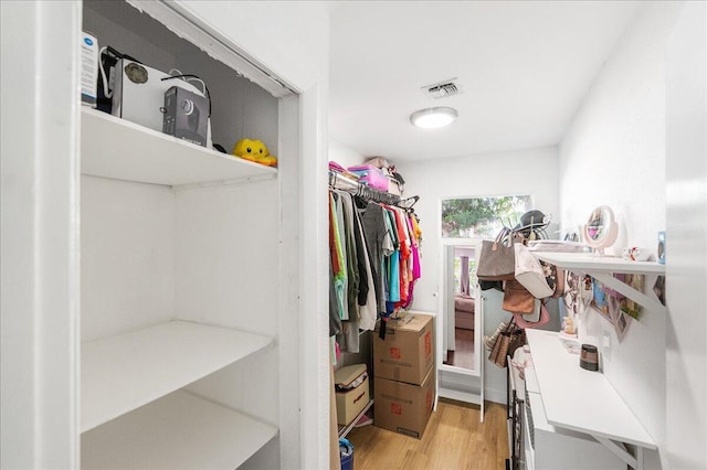 300 SW Prima Vista Blvd, Port Saint Lucie, FL 34983 - walk in closet with light wood-style floors