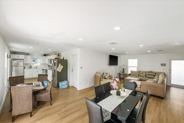 300 SW Prima Vista Blvd, Port Saint Lucie, FL 34983 - dining area featuring light wood-style floors, recessed lighting, and baseboards