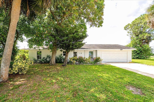 300 SW Prima Vista Blvd, Port Saint Lucie, FL 34983 - single story home featuring concrete driveway, an attached garage, a front lawn, and stucco siding