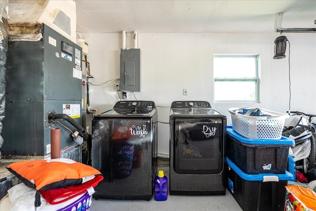 300 SW Prima Vista Blvd, Port Saint Lucie, FL 34983 - laundry area featuring electric panel, washing machine and dryer, and heating unit
