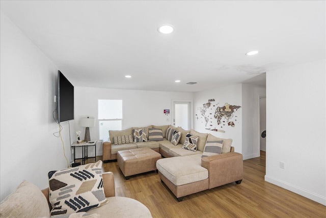 300 SW Prima Vista Blvd, Port Saint Lucie, FL 34983 - living room with light wood-style floors, recessed lighting, plenty of natural light, and baseboards