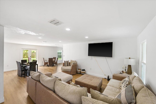 300 SW Prima Vista Blvd, Port Saint Lucie, FL 34983 - living area with light wood-type flooring, recessed lighting, and baseboards
