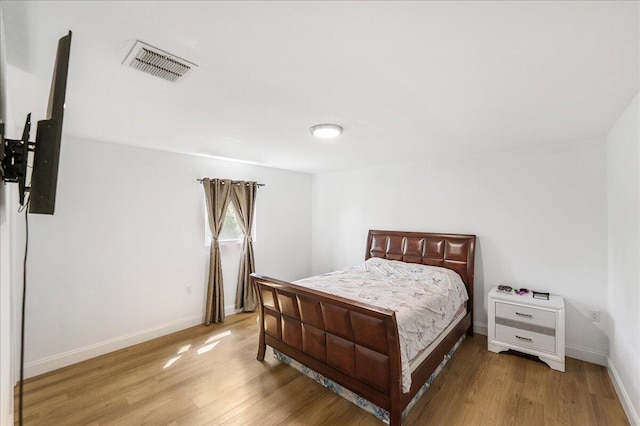 300 SW Prima Vista Blvd, Port Saint Lucie, FL 34983 - bedroom featuring light wood-style flooring and baseboards