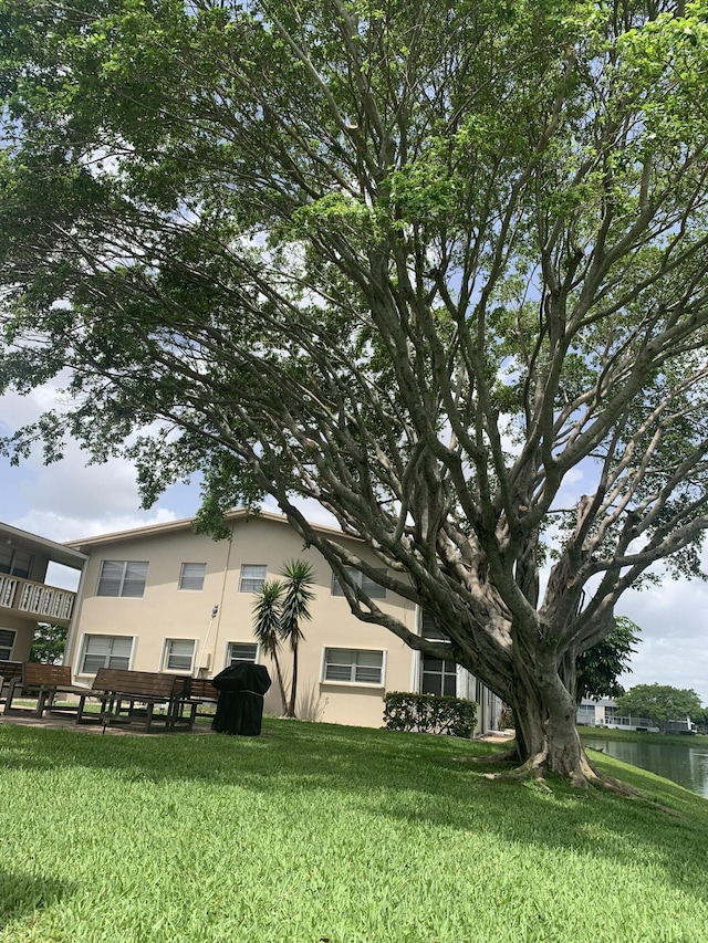 76 Chatham D, West Palm Beach, FL 33417 - view of green lawn featuring a water view