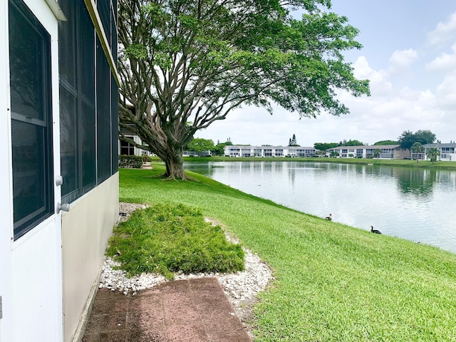 76 Chatham D, West Palm Beach, FL 33417 - view of green lawn with a water view
