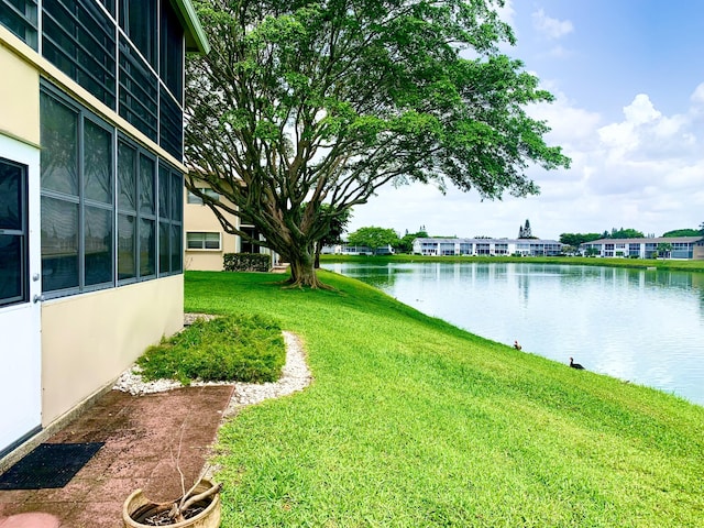 76 Chatham D, West Palm Beach, FL 33417 - view of grassy yard with a water view