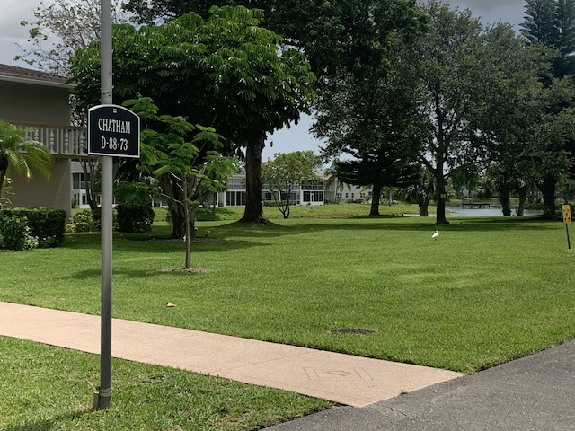 76 Chatham D, West Palm Beach, FL 33417 - surrounding community with a lawn and a water view