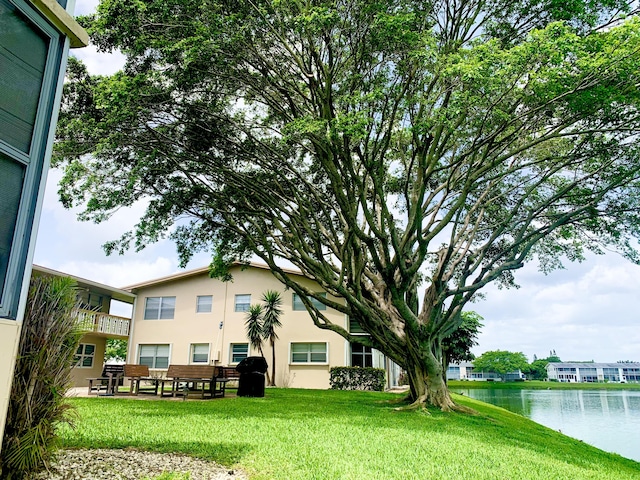 76 Chatham D, West Palm Beach, FL 33417 - view of green lawn featuring a water view