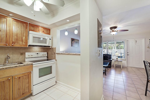 2501 N Ocean Blvd Unit 3, Pompano Beach, FL 33062 - kitchen with white appliances, a ceiling fan, backsplash, light tile patterned floors, and brown cabinets