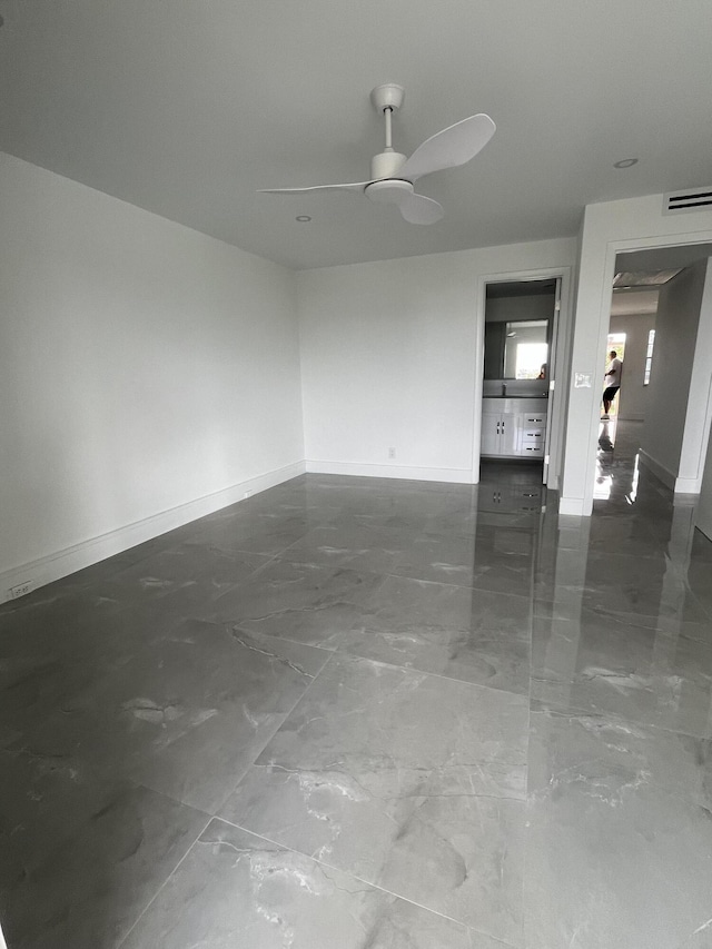 3033 Wolverton B, Boca Raton, FL 33434 - empty room with a ceiling fan and marble finish flooring