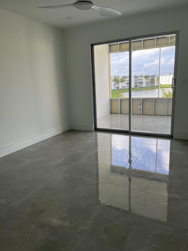 3033 Wolverton B, Boca Raton, FL 33434 - empty room with baseboards and a ceiling fan