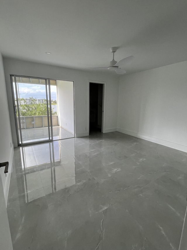 3033 Wolverton B, Boca Raton, FL 33434 - empty room featuring baseboards and a ceiling fan