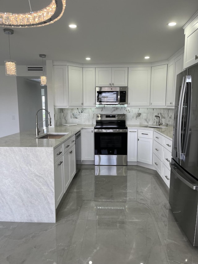 3033 Wolverton B, Boca Raton, FL 33434 - kitchen with stainless steel appliances, backsplash, a peninsula, white cabinets, and recessed lighting