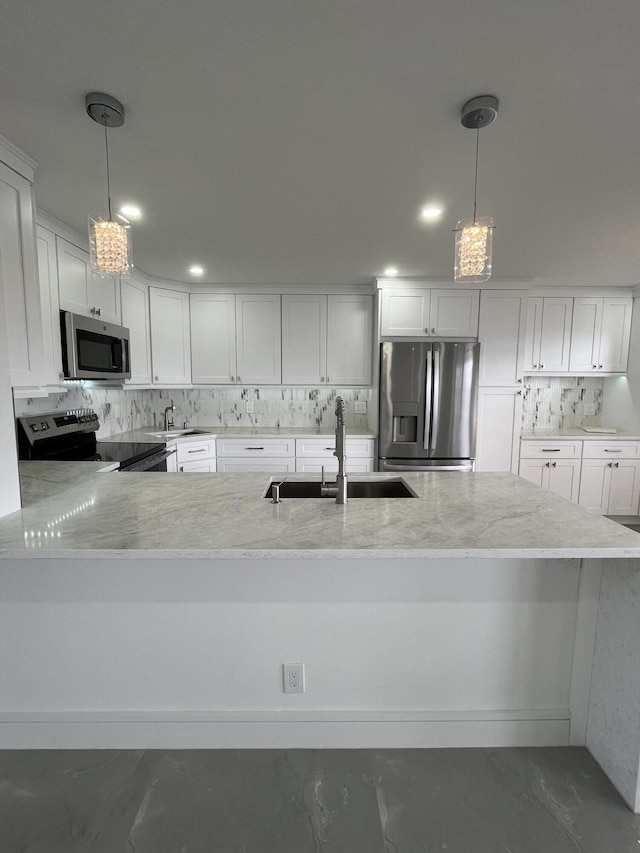 3033 Wolverton B, Boca Raton, FL 33434 - kitchen with stainless steel appliances, decorative backsplash, white cabinets, and decorative light fixtures