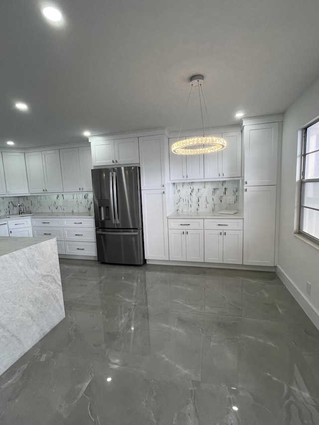 3033 Wolverton B, Boca Raton, FL 33434 - kitchen with stainless steel fridge with ice dispenser, marble tiled flooring, recessed lighting, decorative backsplash, and white cabinetry