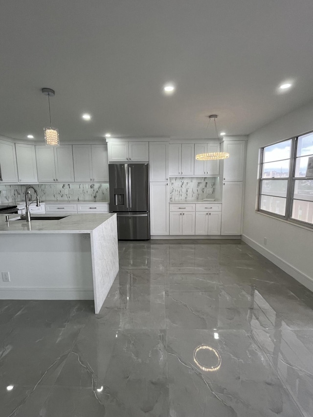 3033 Wolverton B, Boca Raton, FL 33434 - kitchen featuring stainless steel fridge with ice dispenser, backsplash, marble finish flooring, light countertops, and recessed lighting