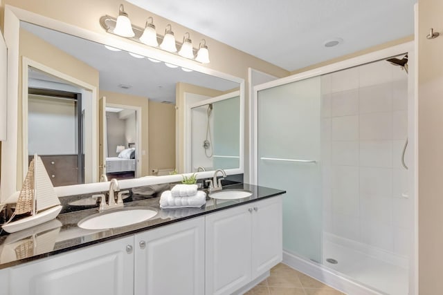 11013 Legacy Ln Unit 103, Palm Beach Gardens, FL 33410 - full bath with ensuite bathroom, double vanity, a stall shower, and tile patterned floors