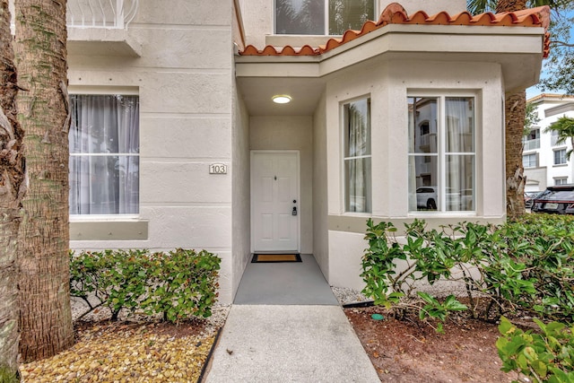 11013 Legacy Ln Unit 103, Palm Beach Gardens, FL 33410 - entrance to property featuring a tiled roof and stucco siding
