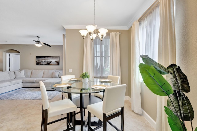 11013 Legacy Ln Unit 103, Palm Beach Gardens, FL 33410 - dining area featuring ornamental molding, light tile patterned floors, a chandelier, ceiling fan, and arched walkways