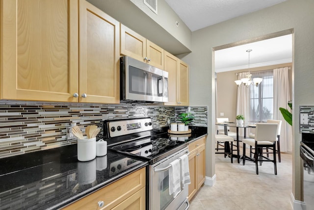 11013 Legacy Ln Unit 103, Palm Beach Gardens, FL 33410 - kitchen with stainless steel appliances, light brown cabinets, backsplash, dark stone countertops, and crown molding