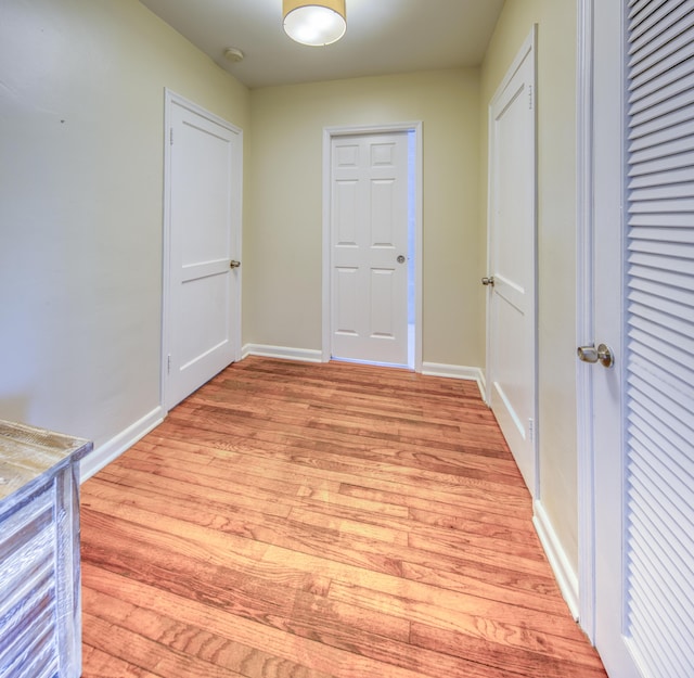 1714 N Palmway, Lake Worth Beach, FL 33460 - hallway with light wood-style flooring and baseboards
