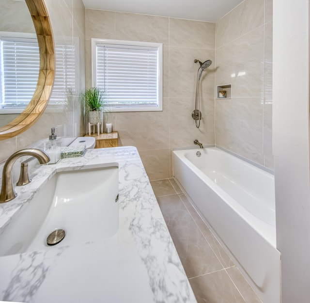 1714 N Palmway, Lake Worth Beach, FL 33460 - bathroom featuring tile walls, vanity, and bathtub / shower combination