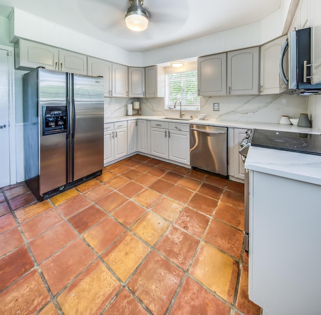 1714 N Palmway, Lake Worth Beach, FL 33460 - kitchen with stainless steel appliances, a sink, ceiling fan, and tasteful backsplash