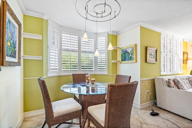 3606 S Ocean Blvd Unit 201, Highland Beach, FL 33487 - dining area with wainscoting, a textured ceiling, crown molding, and tile patterned flooring