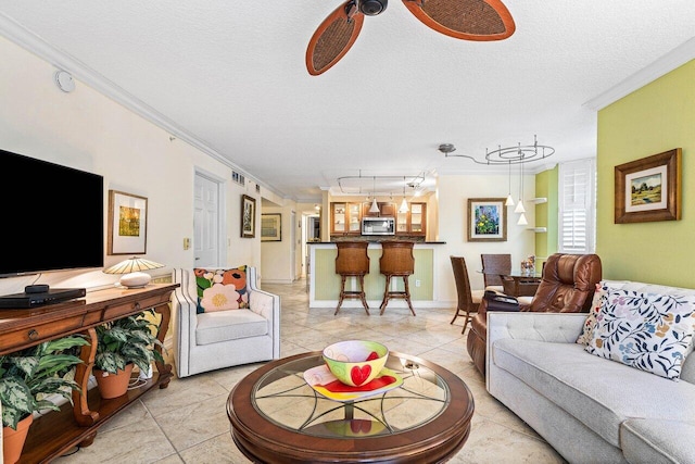3606 S Ocean Blvd Unit 201, Highland Beach, FL 33487 - living area with crown molding, light tile patterned flooring, a textured ceiling, and baseboards