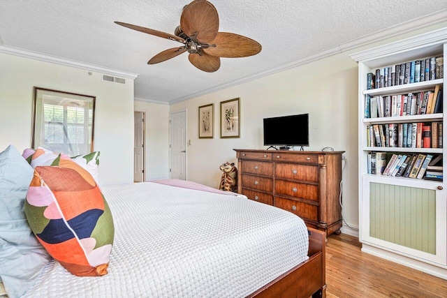 3606 S Ocean Blvd Unit 201, Highland Beach, FL 33487 - bedroom featuring crown molding, wood finished floors, a textured ceiling, and a ceiling fan
