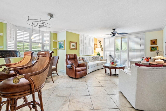 3606 S Ocean Blvd Unit 201, Highland Beach, FL 33487 - living room with crown molding, plenty of natural light, ceiling fan, a textured ceiling, and light tile patterned flooring