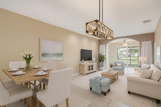 5779 Island Reach Ln, Boynton Beach, FL 33437 - living area with arched walkways, light tile patterned floors, and light carpet