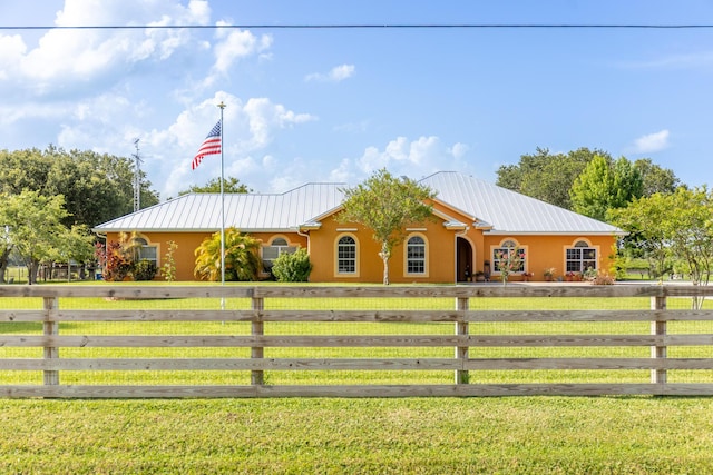 7611 SW 21st Pkwy, Okeechobee, FL 34974 - ranch-style house featuring concrete driveway, stucco siding, and metal roof